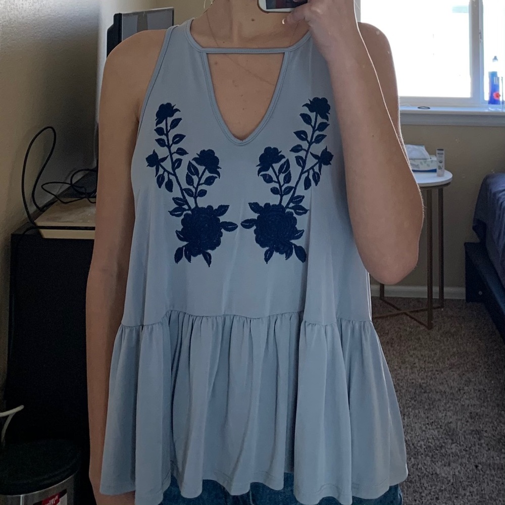 baby blue shirt with dark blue flowers